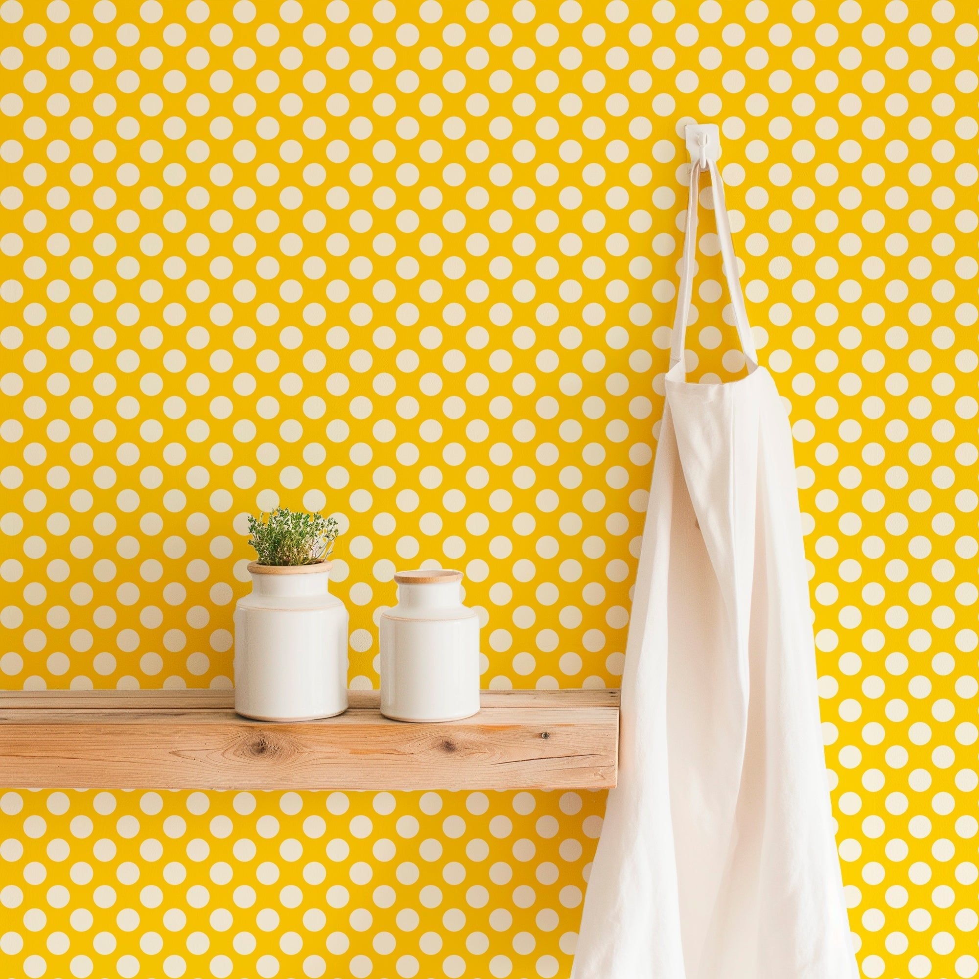 Modernist dot yellow wallpaper shown on a kitchen wall