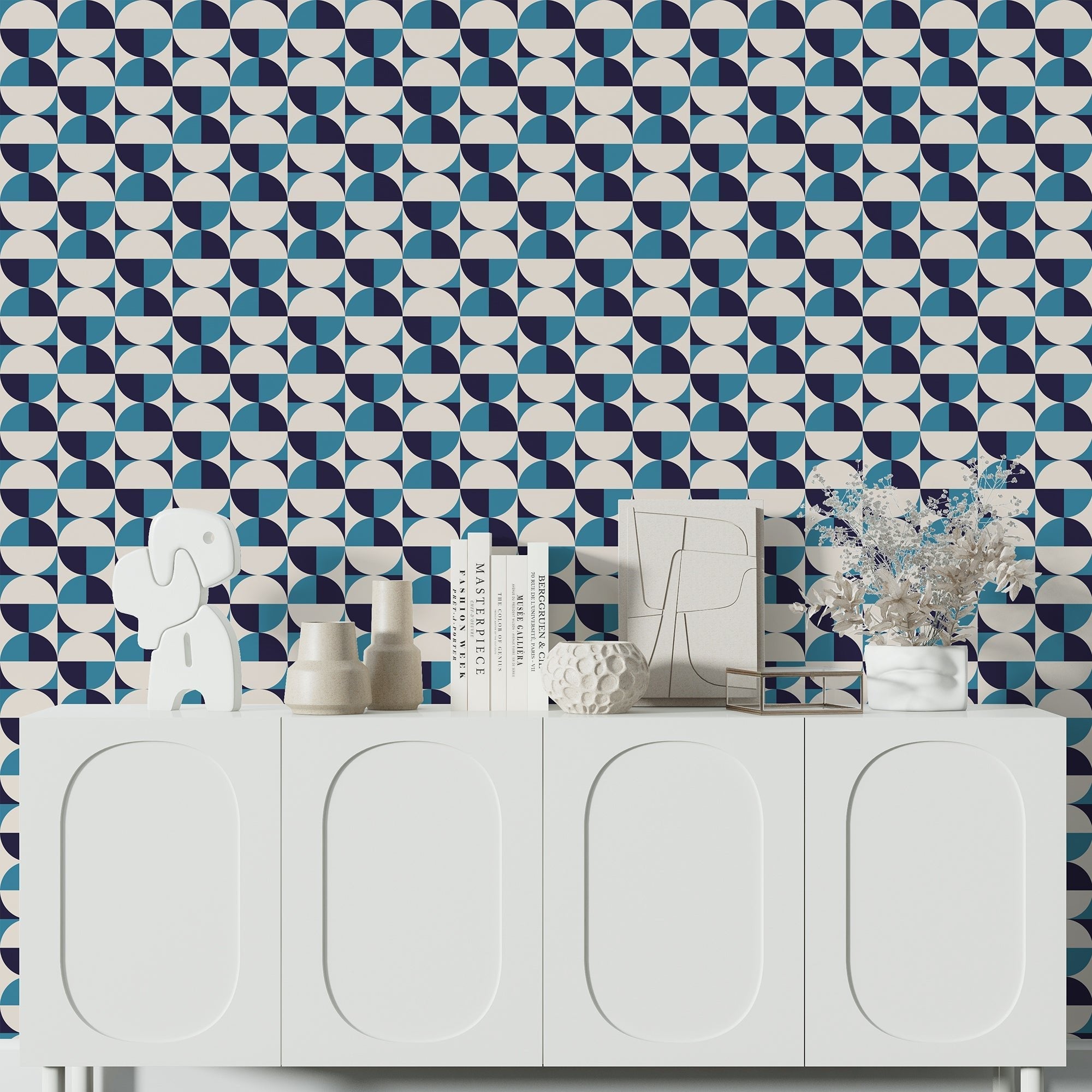 shady in blue bauhaus wallpaper on a wall behind a very modern white credenza