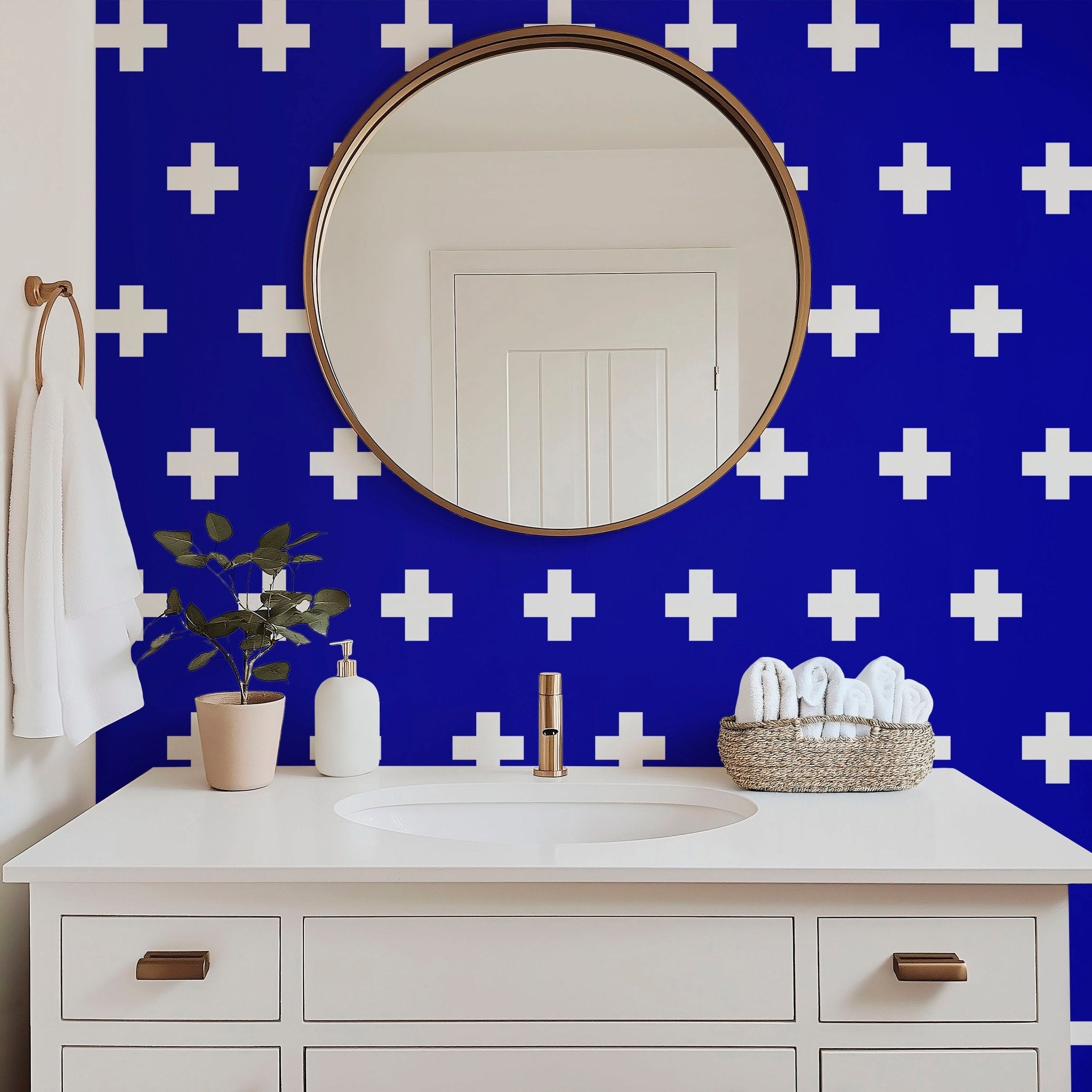 swiss cross scandinavian wallpaper in blue and white in a modern white bathroom