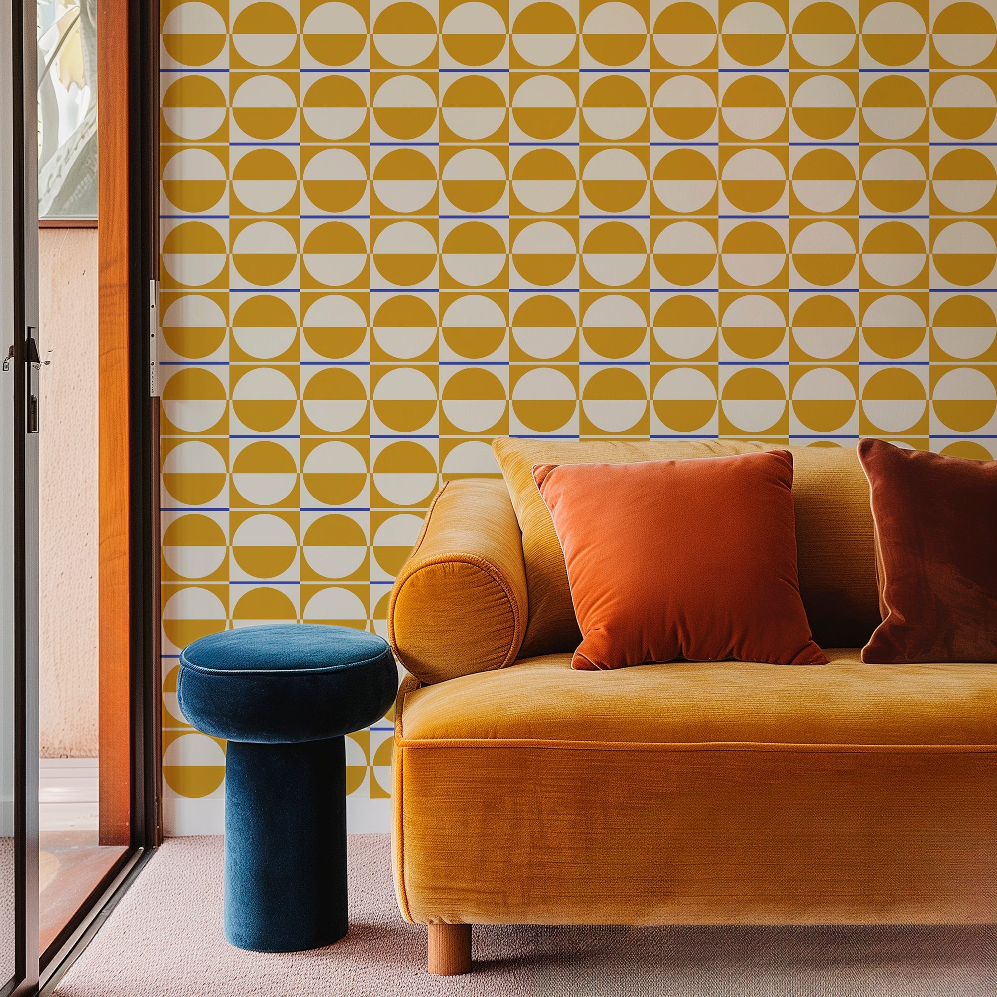 mid century modern gold wallpaper in a living room behind a velvet couch
