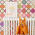 Retro earthy circles wallpaper by Victoria Bright Home — styled nursery room mockup, cropped view